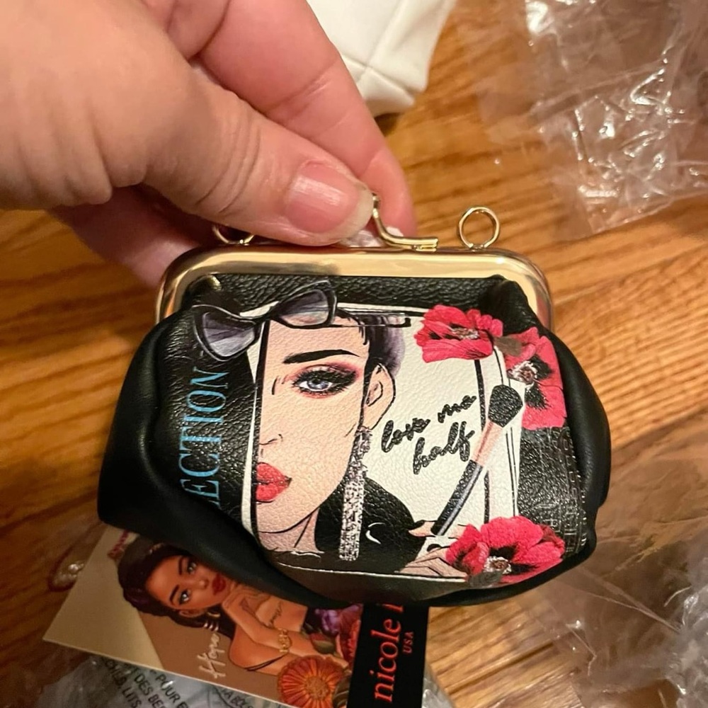 Small NL wristlet purse. $32 each.